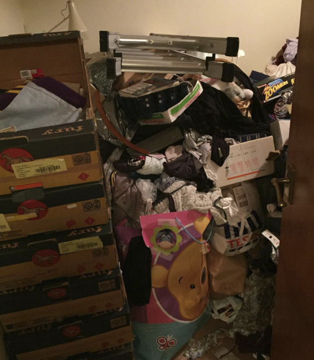 Bedroom doorway blocked with stacked boxes